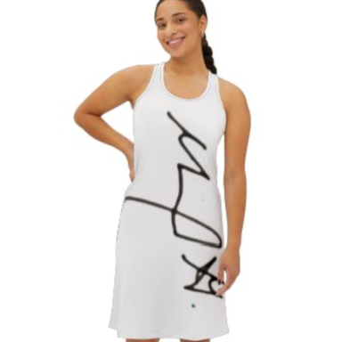 A woman in a sleeveless white dress featuring a bold black graphic design.